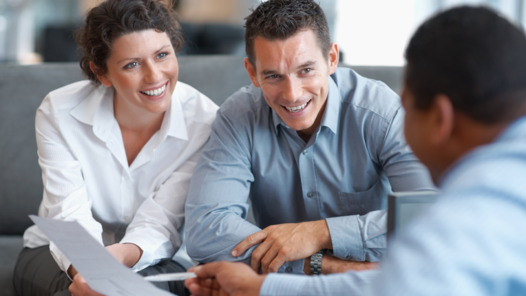 A couple getting investment advice from their advisor