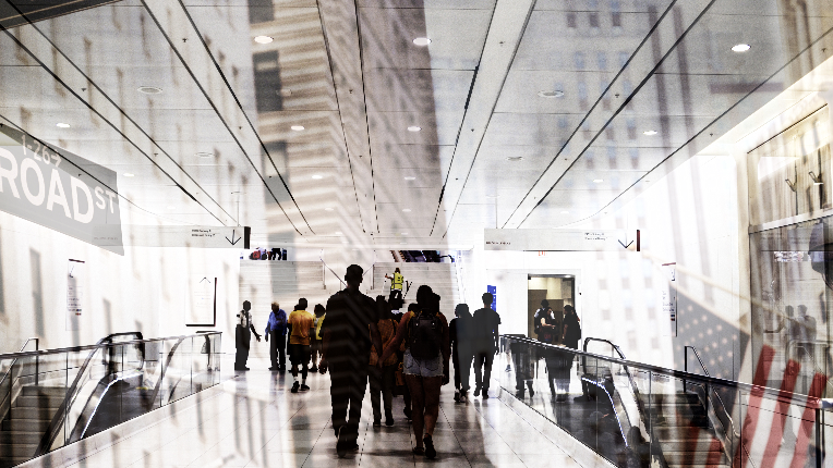 People walking on Wall Street in New York