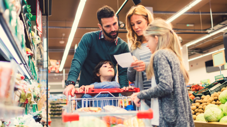 Mother, father and child in the grocery store.
