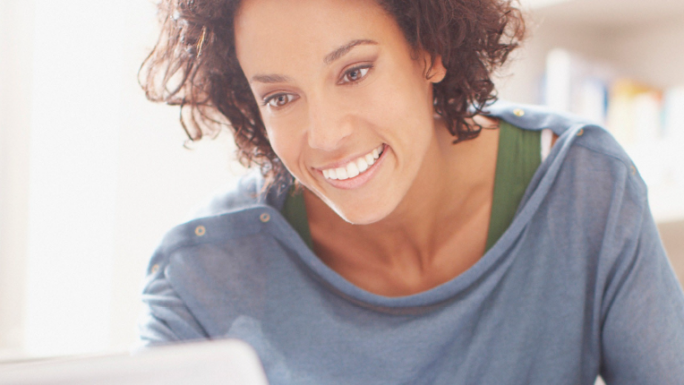 Woman looking at laptop